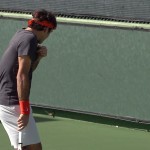 Tommy Haas tries to nail Roger Federer